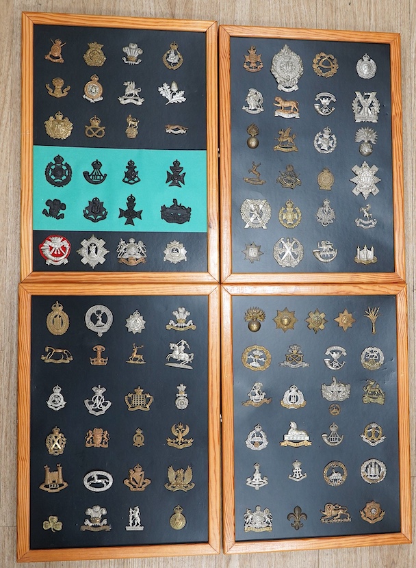 A collection of ninety-seven military cap badges mounted on four boards including; The City of London Yeomanry, Duke of Lancaster‘s Own, Bedfordshire Regiment, Leicestershire Regiment, Seventh Battalion Hampshire Regimen